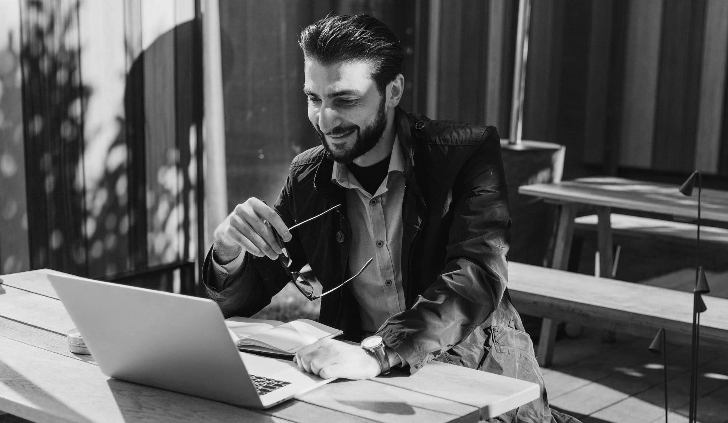 Man working on laptop outside